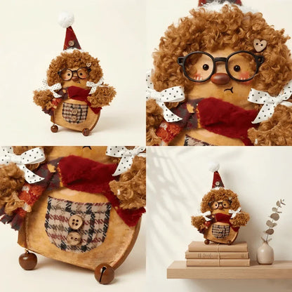Curly-haired handmade plush figure with glasses, plaid pocket, red scarf, and festive hat on shelf.
